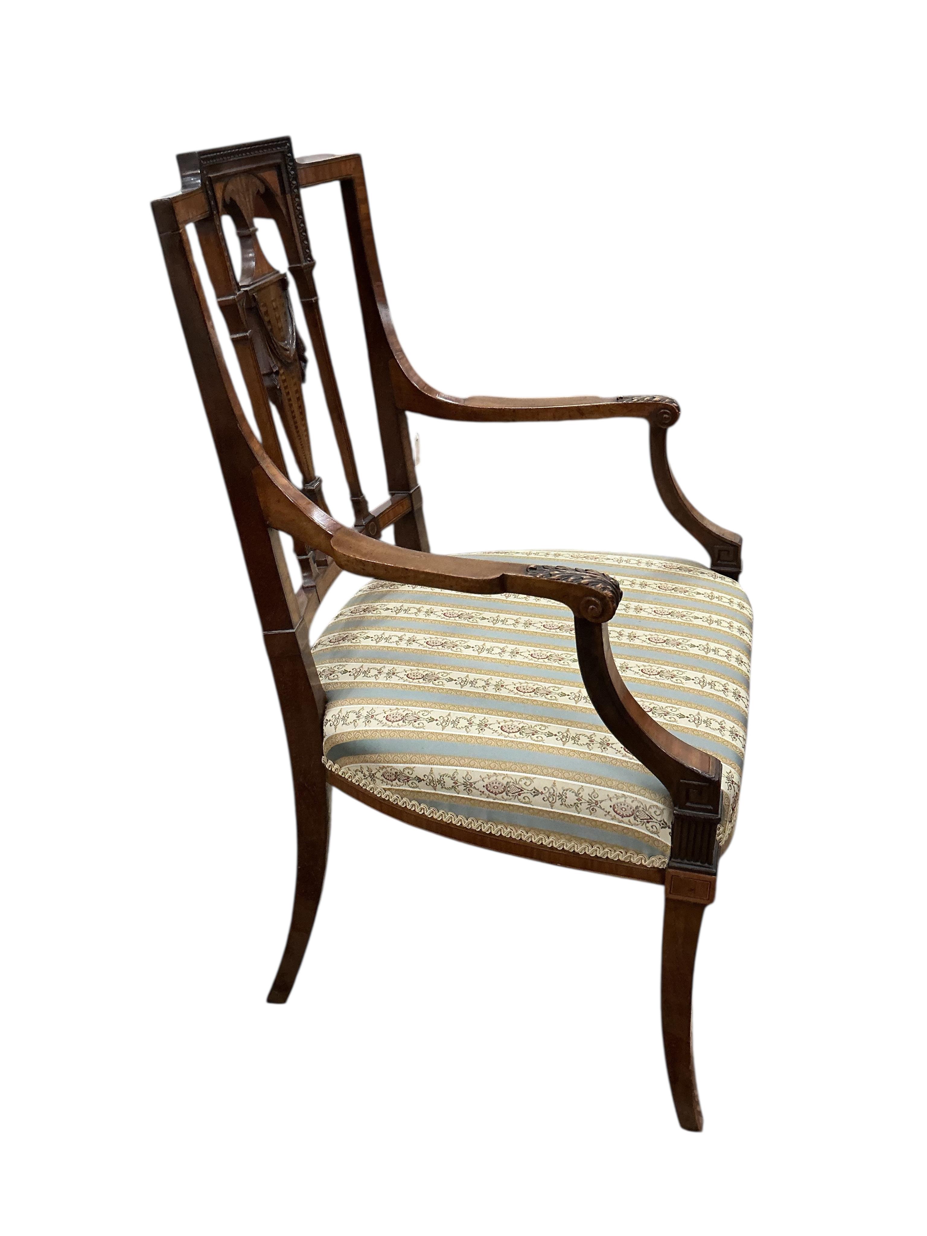 A set of five Edwardian Sheraton revival mahogany and marquetry dining chairs, one with arms, and a Victorian dressing stool